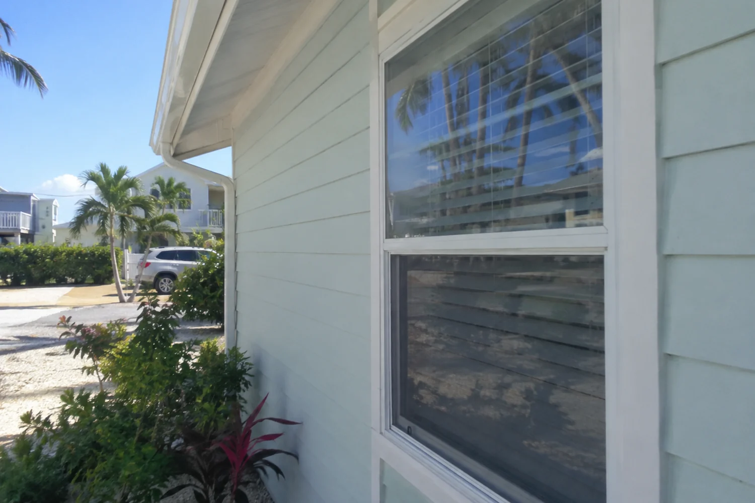 Compact Fort Myers Beach home window and light exterior wall